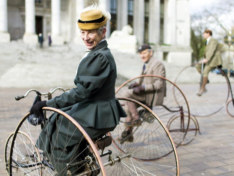 Members of the Pickwick Bicycle Club ride their antique machines during events surrounding the unveiling of a statue of late British writer Charles Dickens at Guildhall Square in Portsmouth on February 7, 2014.  The statue, the only one of Dickens in Britain, was unveiled on the 202nd anniversary of his birth in the city.  AFP PHOTO / CHRIS ISON        (Photo credit should read CHRIS ISON/AFP via Getty Images)