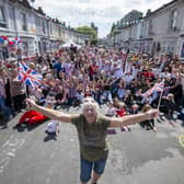 Agincourt Road street party organiser Maureen Maples celebrates the Coronation with the street party
