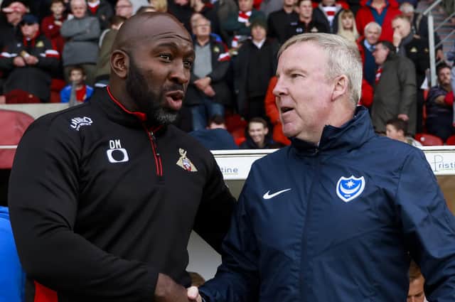 Portsmouth Manager Kenny Jackett and Doncaster Rovers Manager Darren Moore shake hands before the Sky Bet League One match between Doncaster Rovers and Portsmouth at Keepmoat Stadium on October 5th 2019 in Doncaster, England. (Photo by Daniel Chesterton/PinPep)