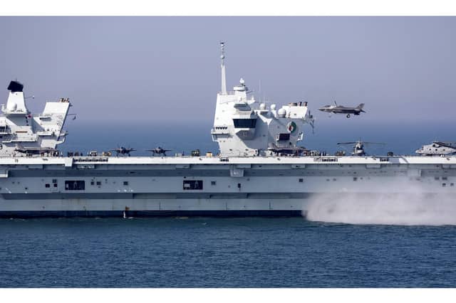 F-35B jets and Merlin Mk2 helicopters on the deck of HMS Queen Elizabeth during an exercise last year