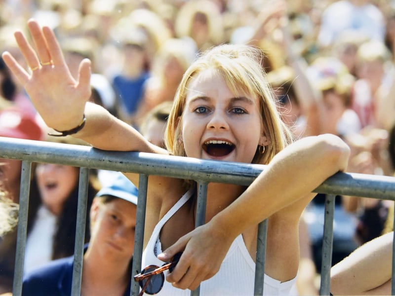 The Radio 1 Roadshow in Southsea, in 1995. A fan waves to her idols.
