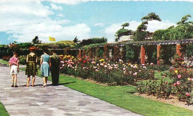 Southsea Rose Garden. A Summer view with Model Village flag beyond