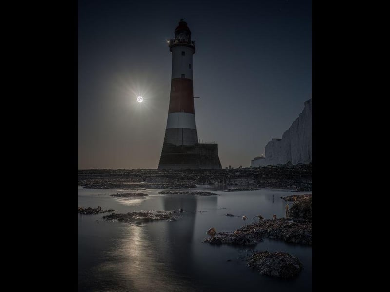 Full moon behind Beachy Head lighthouse by Giles Embleton Smith