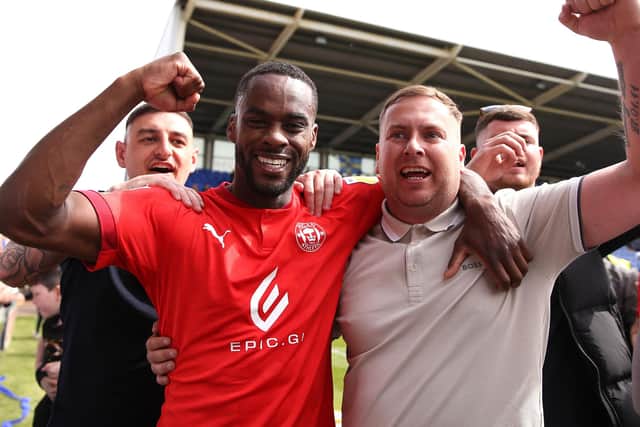 Gavin Massey celebrates Wigan's promotion back to the Championship with Latics fans.  Picture: Tattersall/Getty Images