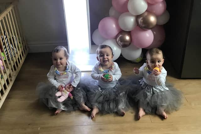 One-year-old triplets Elsie, Emmy and Addison