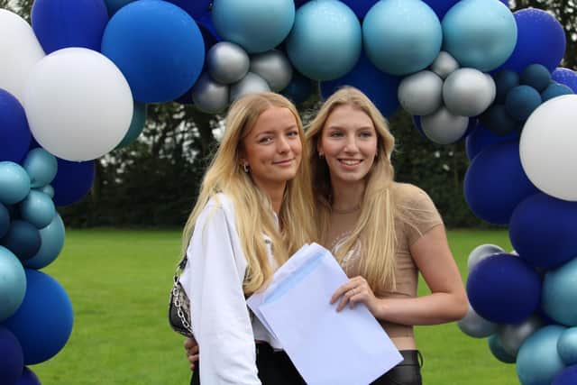 Friends with their results envelopes