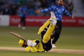 Hampshire's Toby Albert ends up on his backside after being bowled by Rashid Khan. Photo by Warren Little/Getty Images