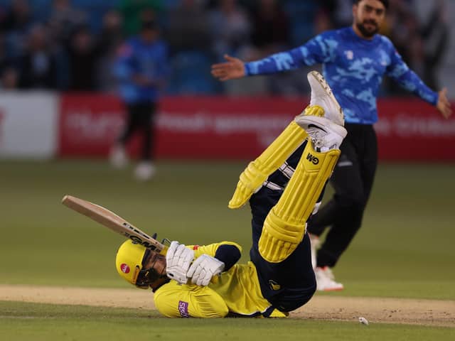 Hampshire's Toby Albert ends up on his backside after being bowled by Rashid Khan. Photo by Warren Little/Getty Images