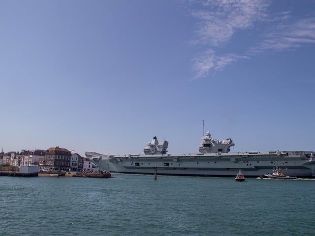 HMS Prince of Wales leaving Portsmouth on Friday 2nd August 2024Pictured: View of HMS Prince of Wales going past Spice IslandPicture: Habibur Rahman