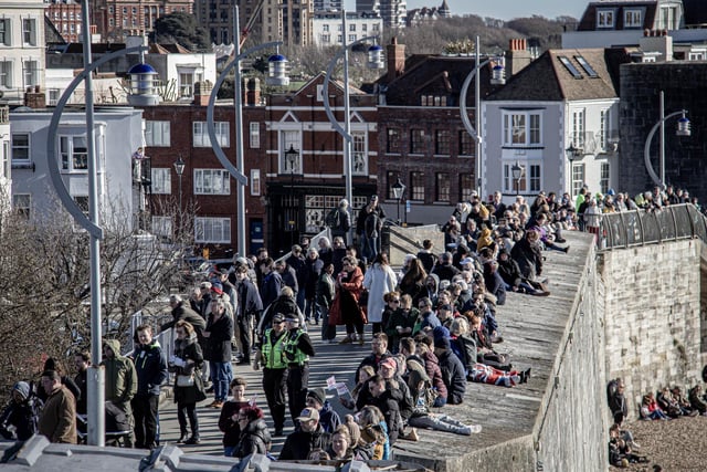Crowds gathering at The Round Tower, Old Portsmouth, to see HMS Prince of Wales.