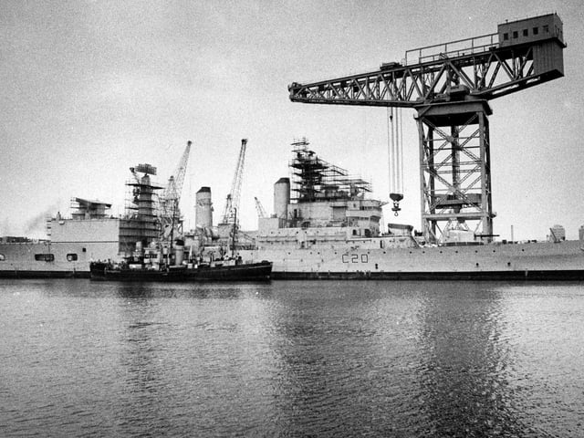 View from Fountain Lake jetty across to HMS Tiger undergoing a refit and the dockyard's 250 ton crane in October 1975. The News PP4195