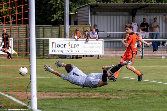 Harrison Brook scores on his AFC Portchester debut against Brockenhurst. Picture: Mike Cooter