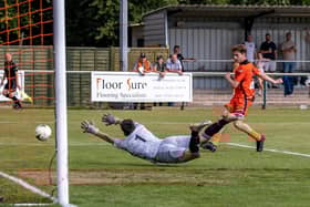 Harrison Brook scores on his AFC Portchester debut against Brockenhurst. Picture: Mike Cooter