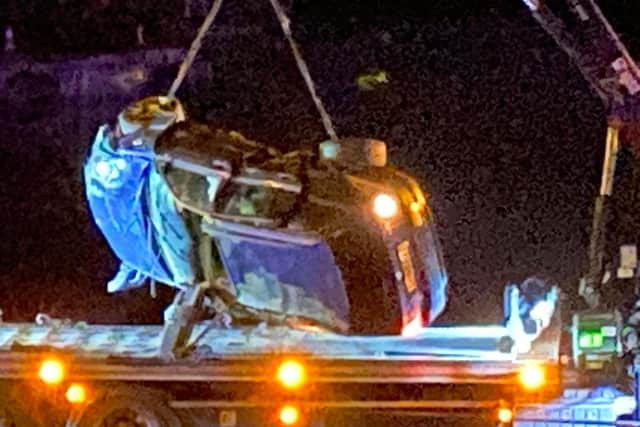 A car being pulled from Fareham Creek in the early hours of January 27, 2022