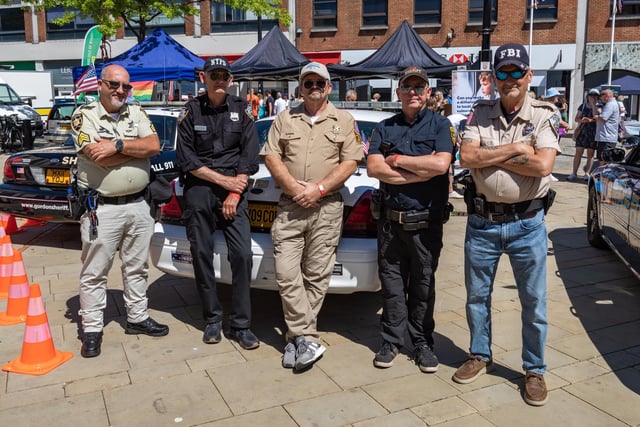 Members of the 'UK 911 Cop Car Network' who attended the event complete with US vehicles. Picture: Mike Cooter (240623)