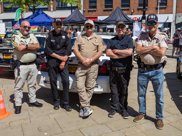 Members of the 'UK 911 Cop Car Network' who attended the event complete with US vehicles. Picture: Mike Cooter (240623)