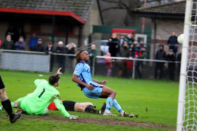 Rafa Ramos fires home his second goal in AFC Portchester's derby victory at Fareham Town. Picture: Sam Stephenson