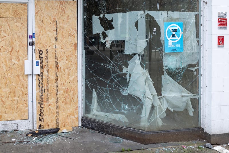 Smashed windows of the former Damart shop on Arundel Street