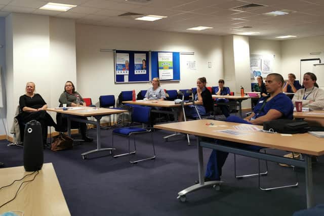 Staff at Queen Alexandra Hospital, Cosham, take part in Southsea Castle Rotary Club's project to highlight experiences of the deaf community