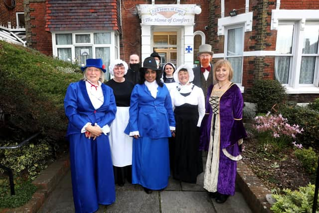 Home of Comfort staff and guests dressed in period clothing.