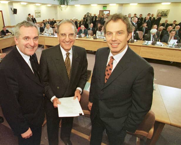 ​Bertie Ahern, Senator George Mitchell and Tony Blair after the signing of the agreement on April 10 1998