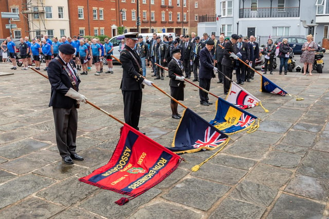 Standards lowered in memory of the fallen at the Falklands Memorial Service at Old Portsmouth.