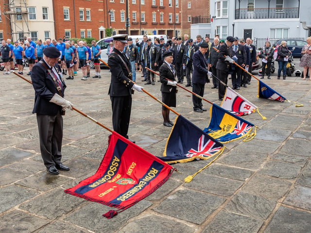Standards lowered in memory of the fallen at the Falklands Memorial Service at Old Portsmouth.