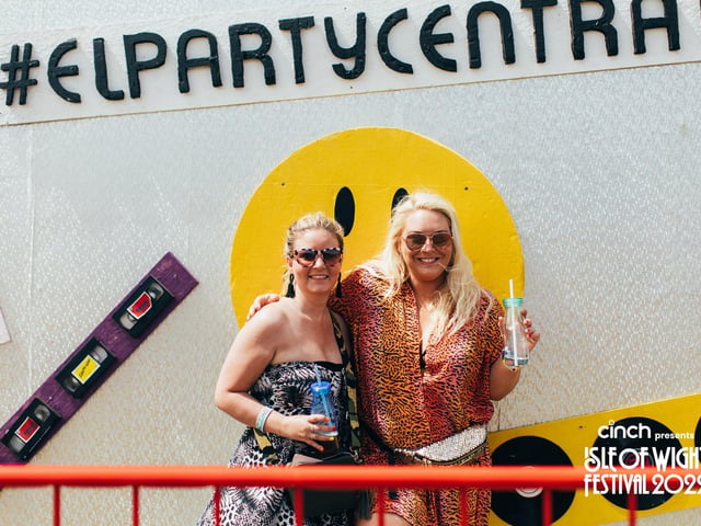 Posing at the #ELPartyCentral sign on the opening Thursday of the Isle of Wight Festival, 2022
