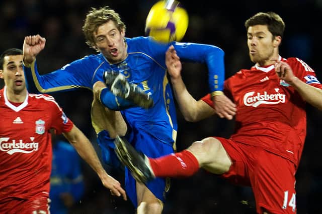 Peter Crouch in action against Liverpool in February 2009 - a game which Pompey lost 3-2.