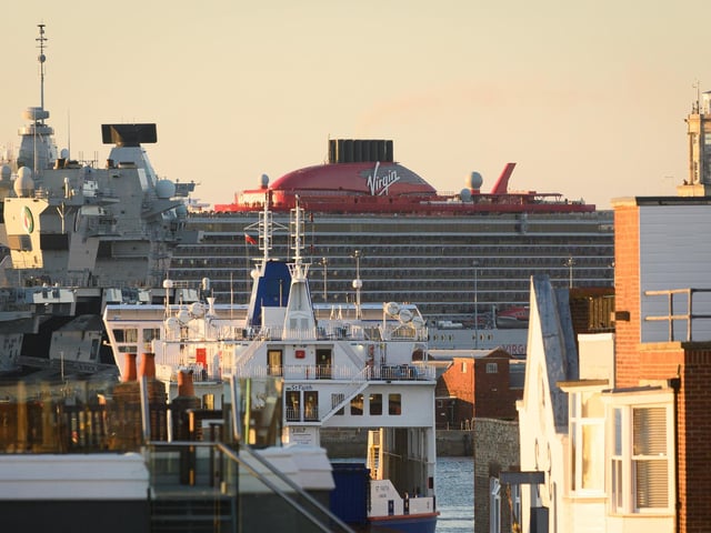 Pictured is: MV Resilient Lady appears between ships in the harbourPicture: Keith Woodland (140921-9)