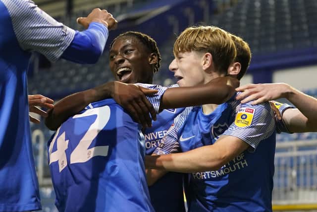 Members of Pompey's Academy celebrate Koby Mottoh's stoppage-time goal in Tuesday night's 5-2 victory over Southampton. Picture: Jason Brown/ProSportsImages