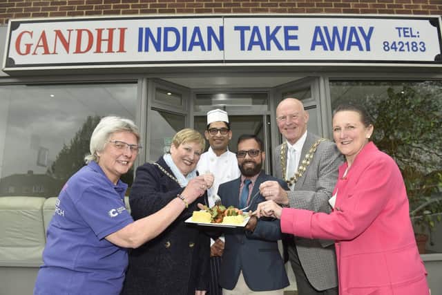 Gandhi Indian takeaway in Anjou Crescent, Fareham, held a charity fundraising evening on Monday. From left, volunteer event chair for Cancer Research UK relay for life Portsmouth Jayne Bowater, Mayoress of Fareham Anne Ford, Pinak Deb, Gandhi owner Abu-Suyeb Tanzam, Mayor of Fareham Mike Ford and Cllr Tina Ellis for Fareham West ward Picture: Sarah Standing (250423-2430)