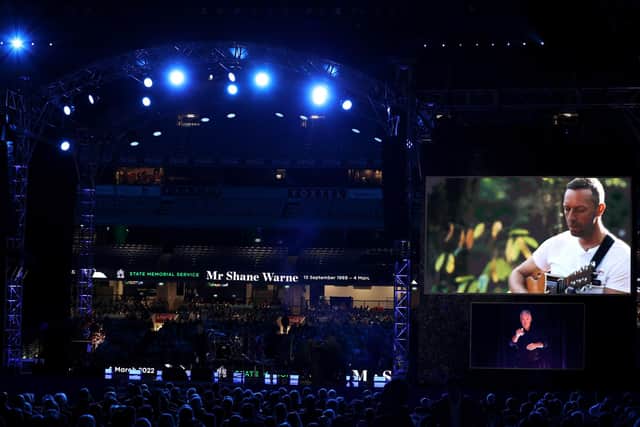 Chris Martin of Coldplay on the big screen during the state memorial service for Shane Warne. Photo by Robert Cianflone/Getty Images.