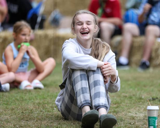 Margo Hodges, 13, enjoys watching Silly Scott perform at All Saints Church, Denmead on Saturday, August 16. Picture: Chris Moorhouse (160825-27)
