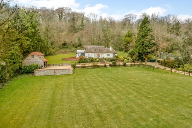 This four bedroom detached house in Green Lane, Hambledon, is on sale for £1,895,000. It is listed by Fine and Country.