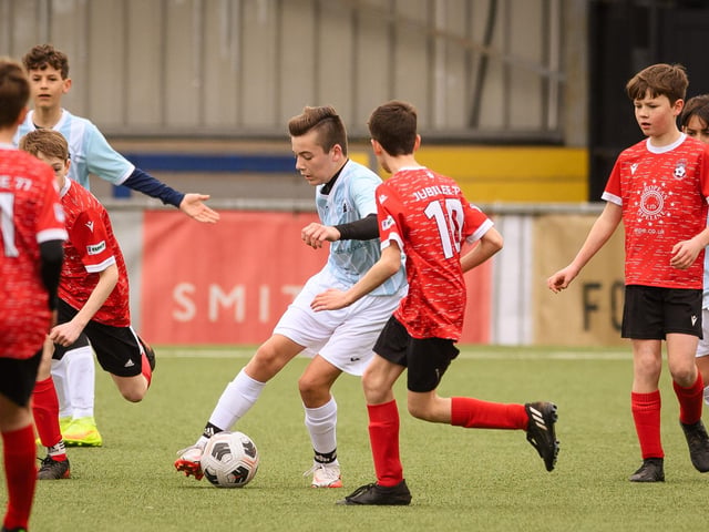 Action from the Portsmouth Youth League Geldard Invitation Cup final between Jubilee 77 U13s and Castle United U13s (light blue and white kit). Picture: Keith Woodland (190321-889)