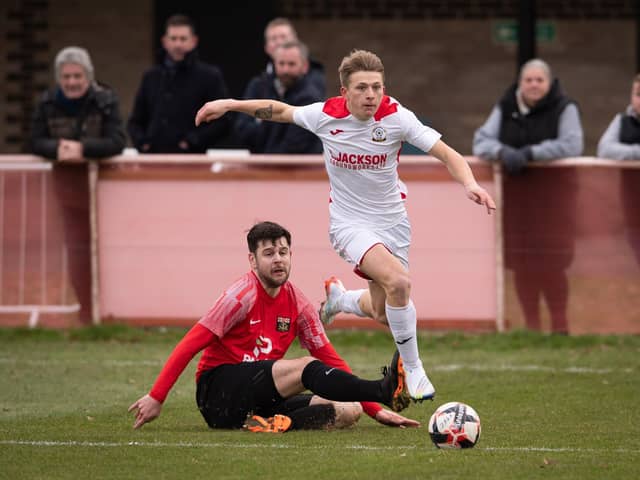 Horndean's Zack Willett (white) has now scored 17 goals in his last nine Wessex Premier starts. Picture: Keith Woodland