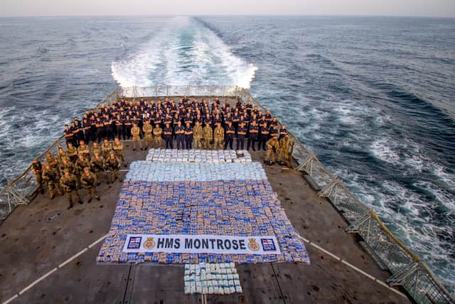 HMS Montrose's crew stand next to the £3m haul of seized drugs. Photo: Royal Navy