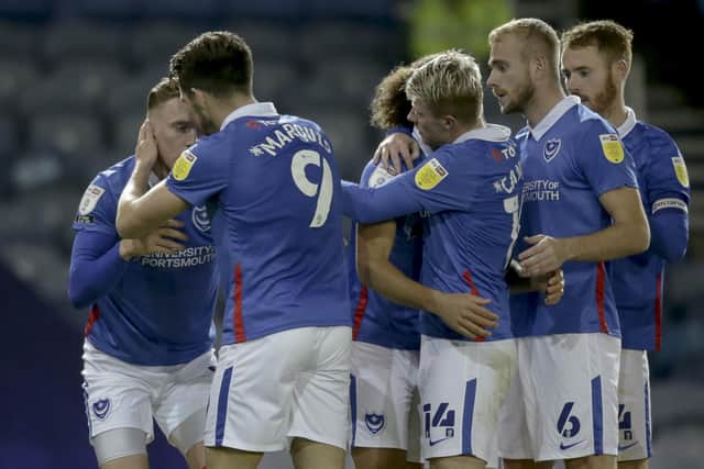 Pompey's players celebrate after Ronan Curtis' first league goal of the season puts them 3-0 up against Northampton last night. Picture: Robin Jones/Getty Images