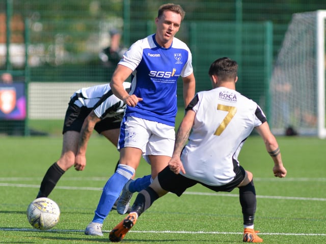 Denmead (blue) v Hayling. Picture by Martyn White