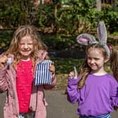 Six-year-olds Alice Stoneham and Morgan Hayward with their prizes for completing the Easter trail. Picture: Mike Cooter (06042023)
