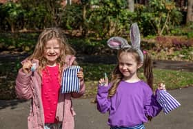 Six-year-olds Alice Stoneham and Morgan Hayward with their prizes for completing the Easter trail. Picture: Mike Cooter (06042023)