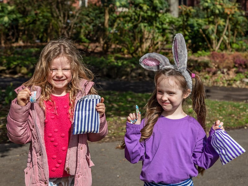 Six-year-olds Alice Stoneham and Morgan Hayward with their prizes for completing the Easter trail. Picture: Mike Cooter (06042023)