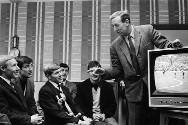 Pompey manager George Smith and his players watch a recording of a match against Birmingham City on March 7, 1968. Picture: Getty