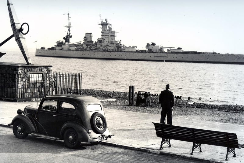Clarence Esplanade, with only a single man as an audience for the battleship HMS Nelson. Taken by a News photographer in the 1930's.