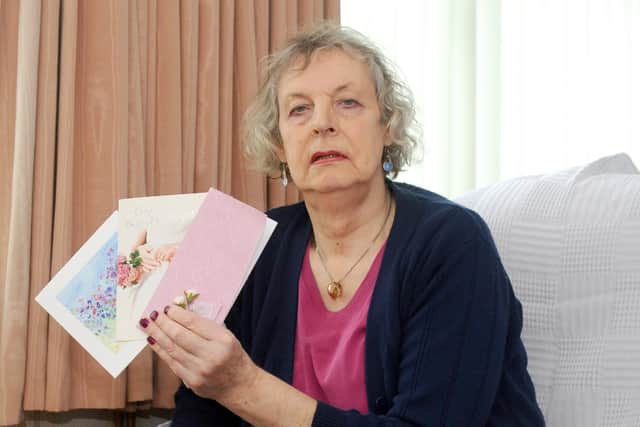 Kim Bristow with some their wedding cards. Picture: Sarah Standing (210220-5948)