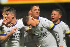Hawks celebrate a goal during tonight's FA Cup win over higher division Torquay. Picture: Martyn White