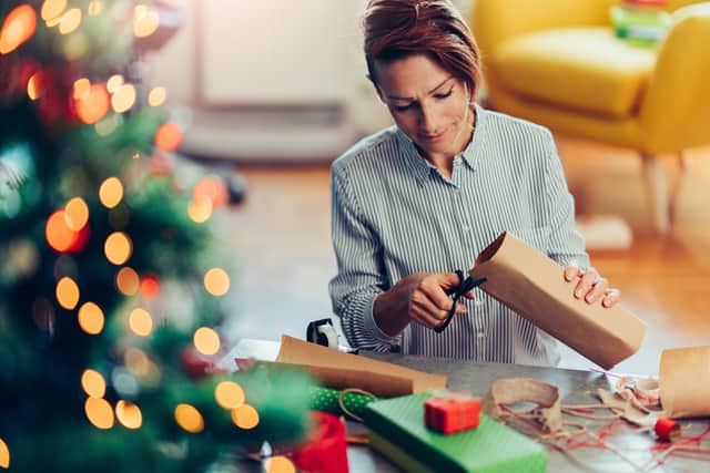 Wrapping Christmas presents. Picture: Adobe Stock