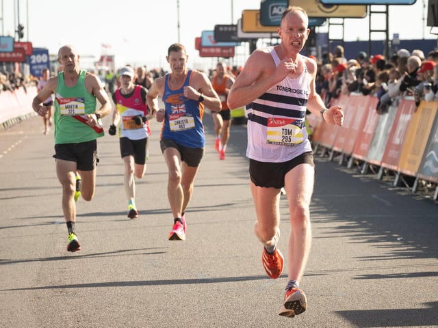 Pictured is: Runners cross the line to finishPicture: Keith Woodland (151021-572)