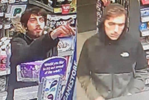 Police want to speak to these two men after a man's debit cards were stolen from his vehicle in Portsmouth